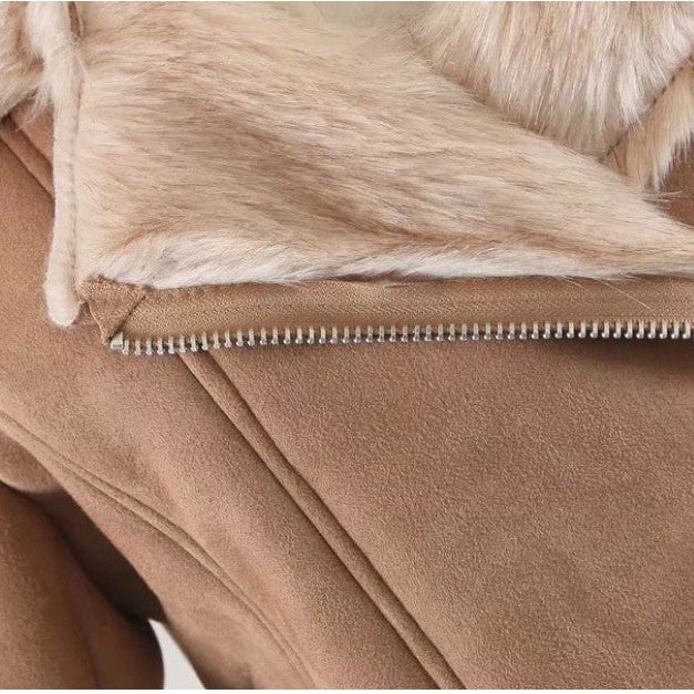 Close-up of a brown jacket with fur lining and zipper