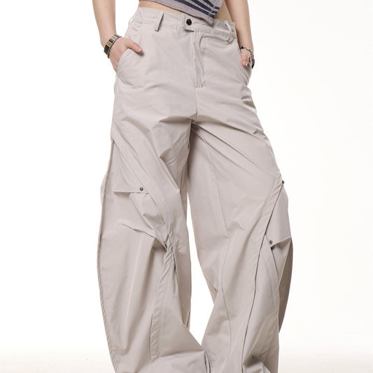 Beige wide-leg pants worn by a person on a white background