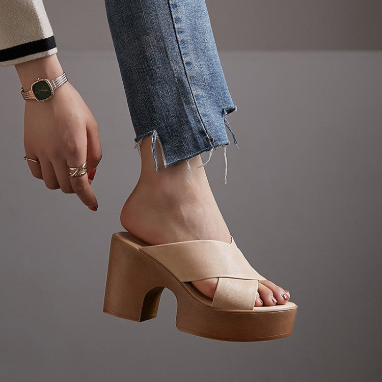 Beige platform sandal worn with blue jeans on a gray background