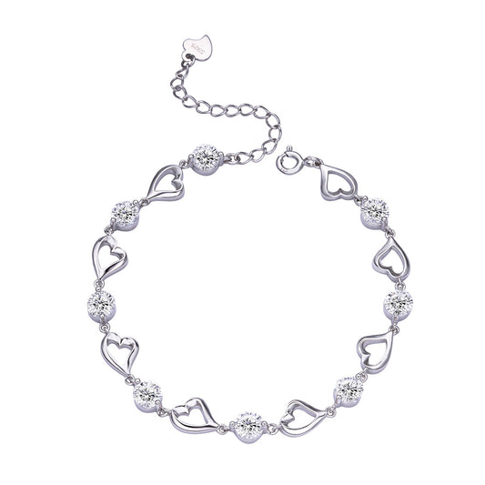 Silver bracelet with heart-shaped links on a white background