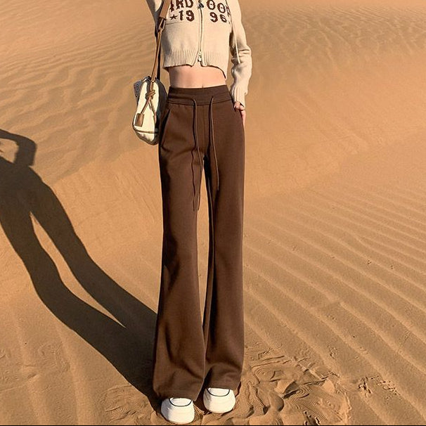 Person standing on a sand dune in a desert landscape