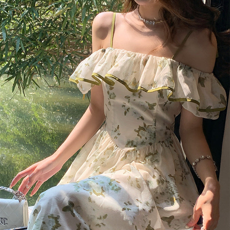Woman wearing a floral dress with greenery in the background