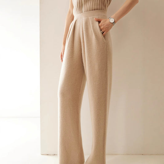 Beige pants worn by a person on a plain background