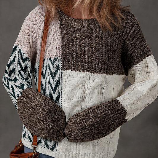 Person wearing a patterned sweater and mittens with a brown bag on a gray background