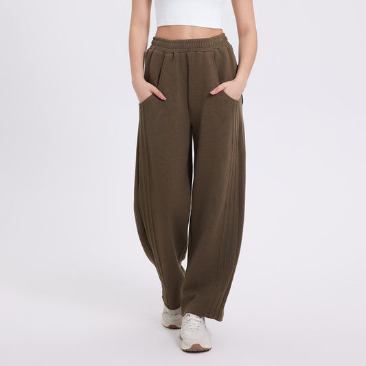 Brown wide-leg pants worn by a person on a white background