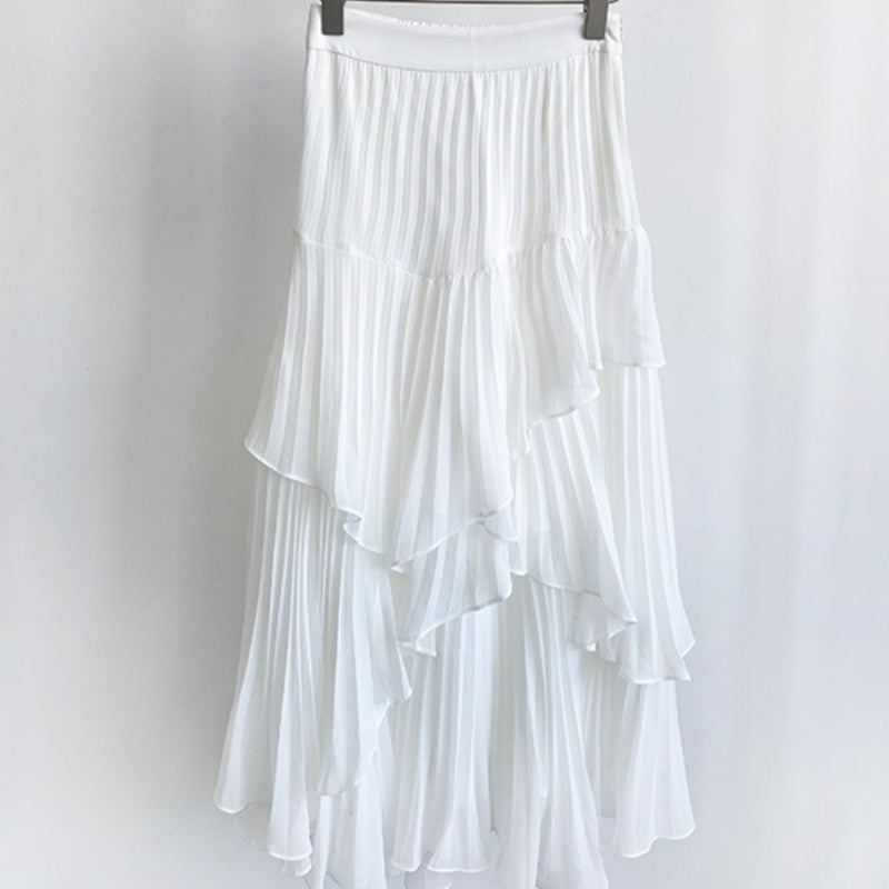 White pleated skirt on a hanger against a white background