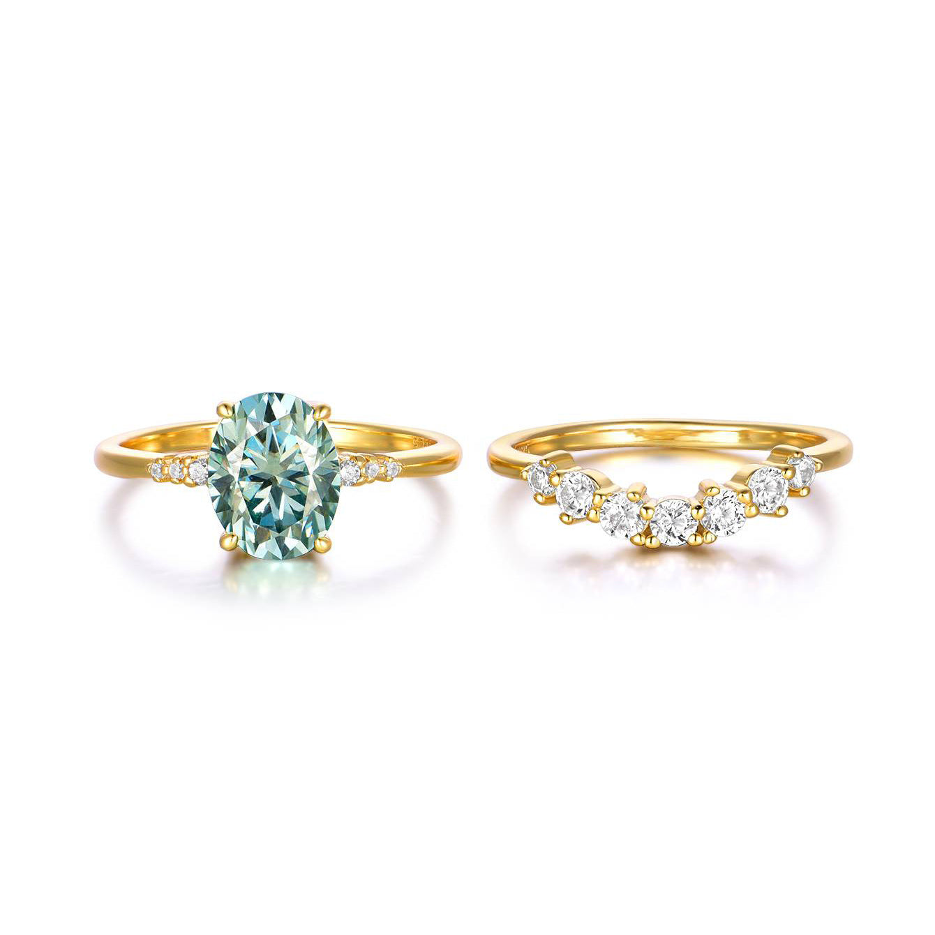Two gold rings with gemstones on a white background
