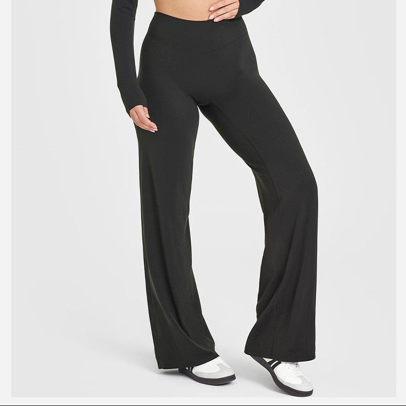 Person wearing a black athletic outfit on a white background