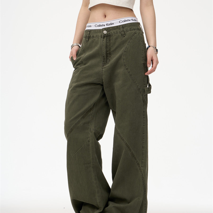 Person wearing olive green cargo pants on a white background