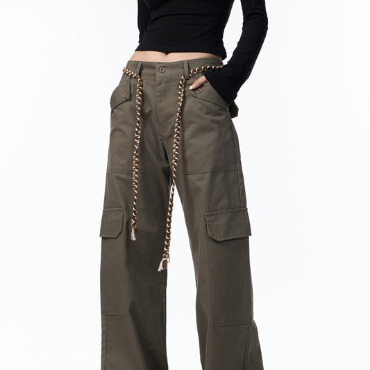 Green cargo pants with decorative chain on a white background