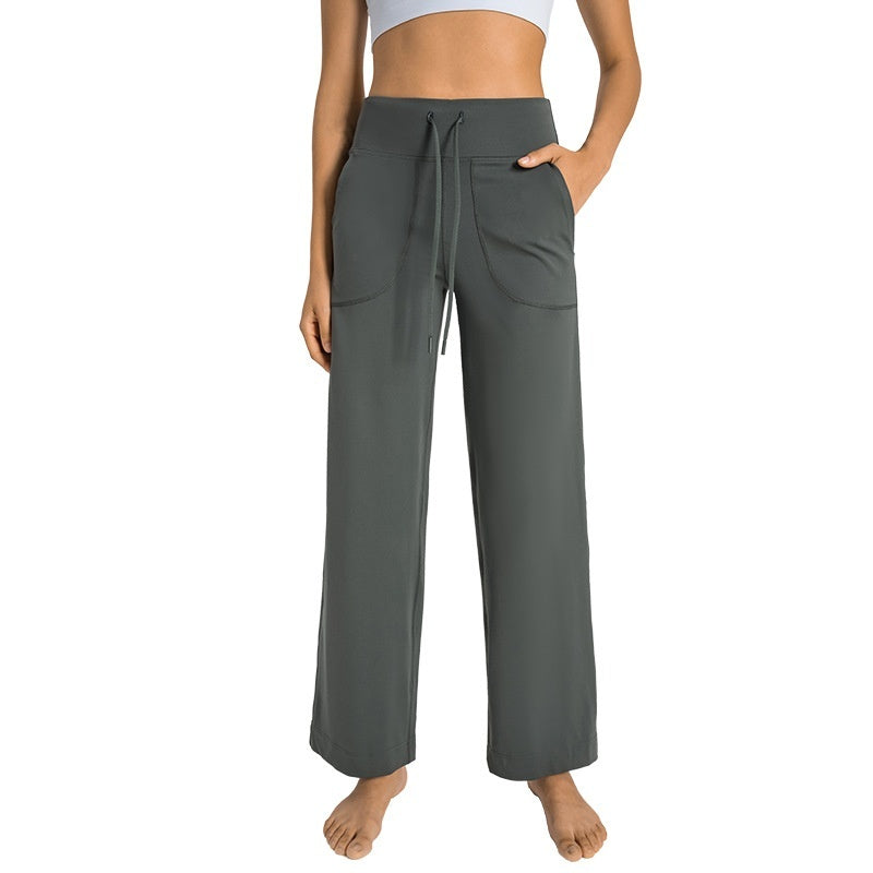 Gray wide-leg pants worn by a person on a white background