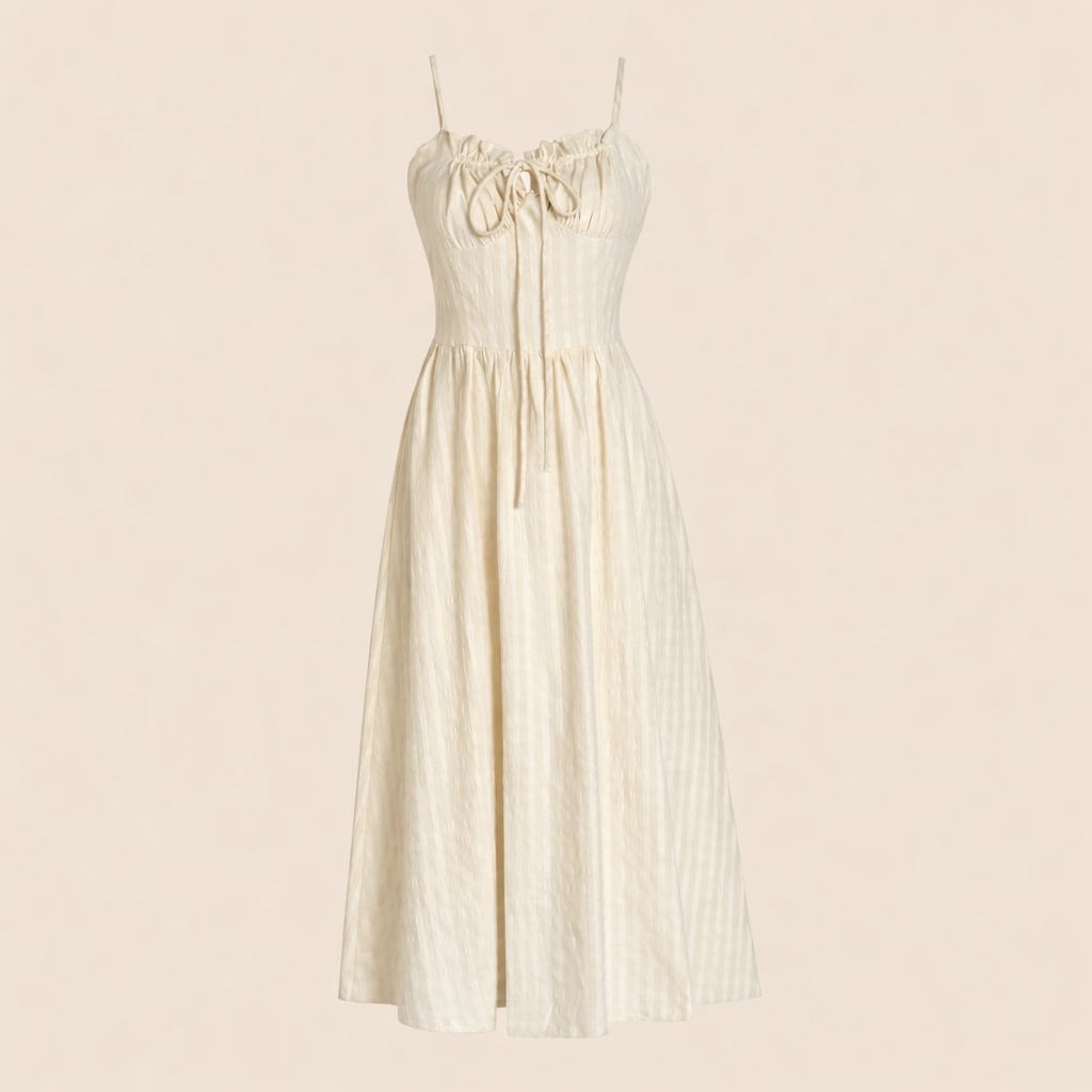 White dress with gold accents on a beige background