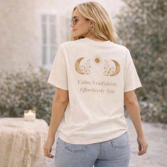 Woman wearing a cream t-shirt with motivational quote outdoors