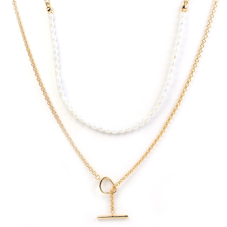 Two gold necklaces with pendants on a white background