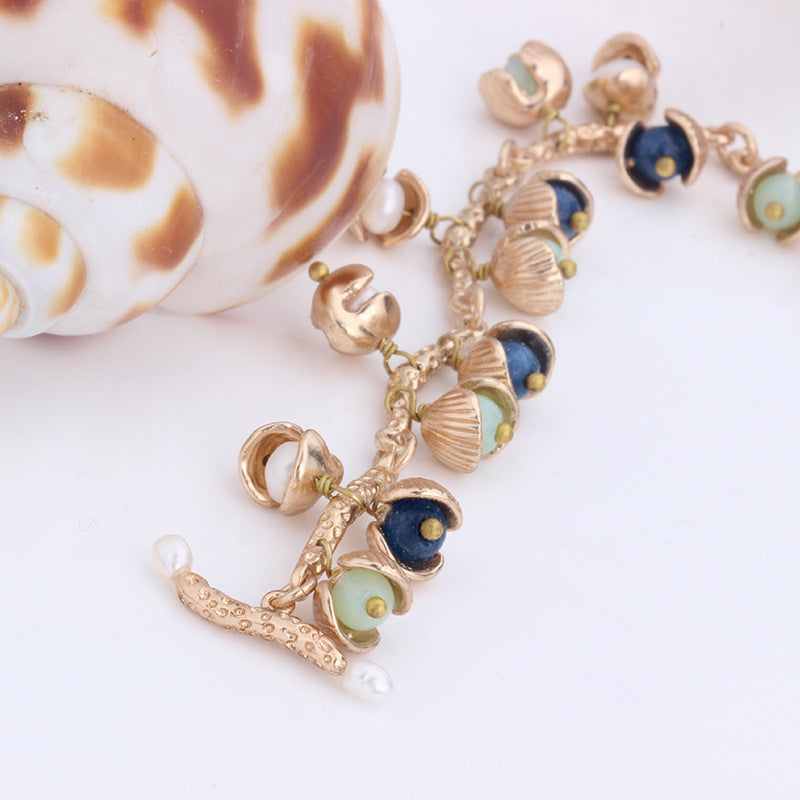 Seashell Freshwater Pearl Charm Bracelet – Gold-Plated Elegance