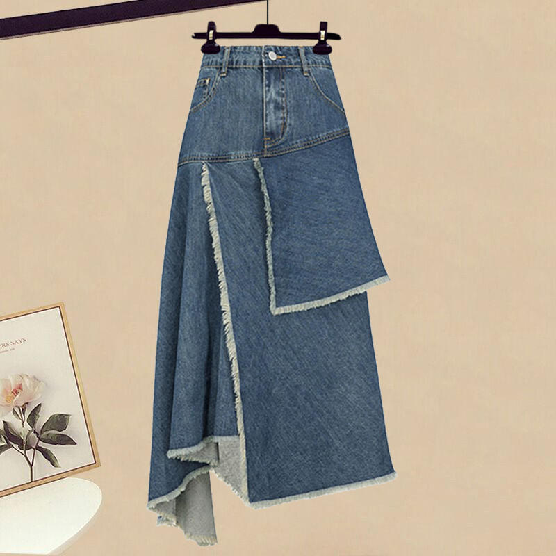 Blue denim skirt on a hanger against a beige background