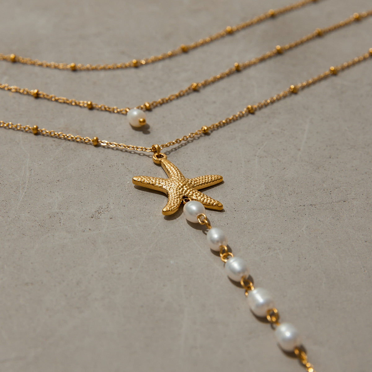 Golden Tides Starfish Pearl Drop Necklace